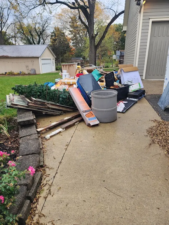 Dumpster being loaded with debris for Demolition Dumpster Rental in Parlier